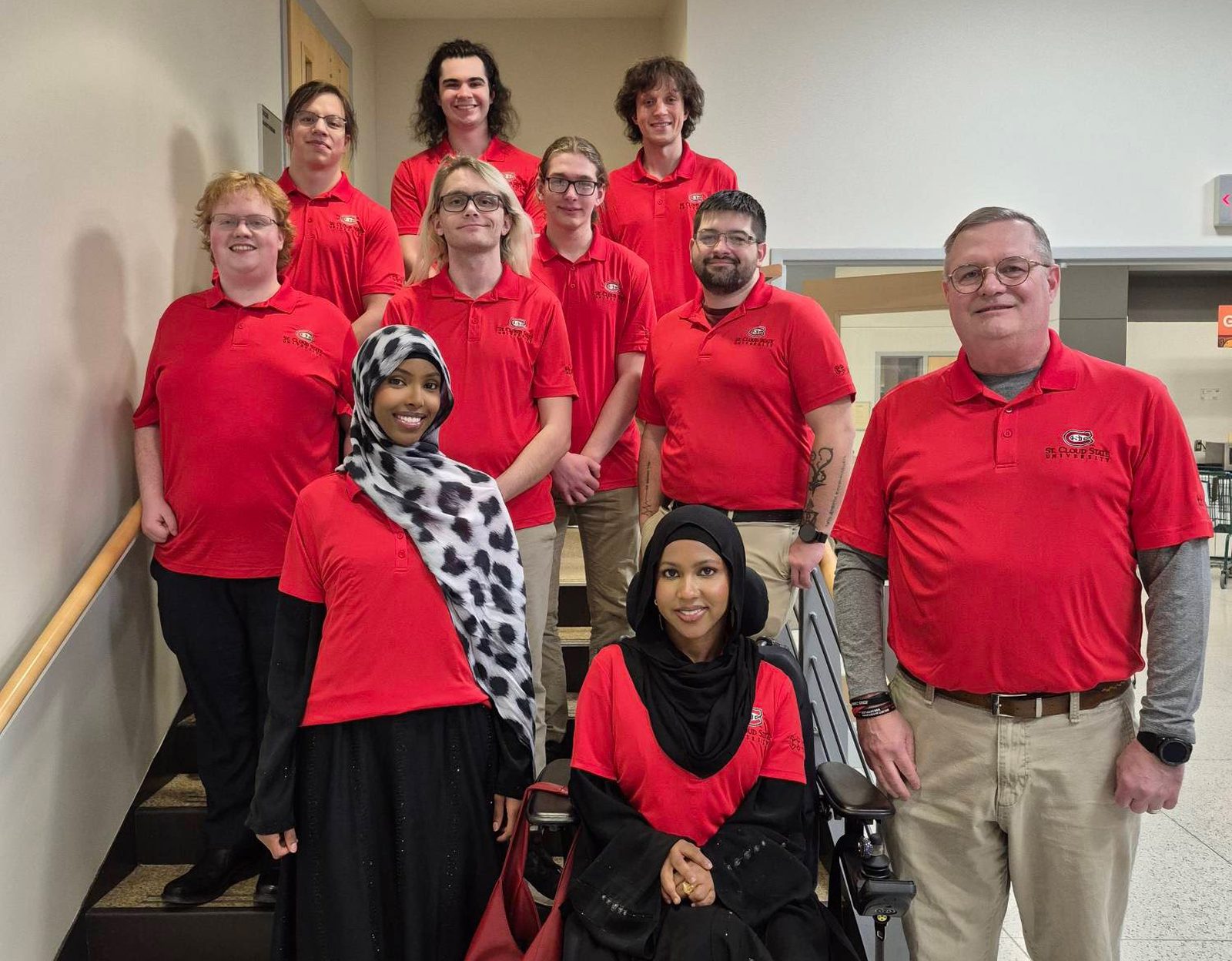 The SCSU Cyber Competition Club CCDC team in matching red St. Cloud State polos.